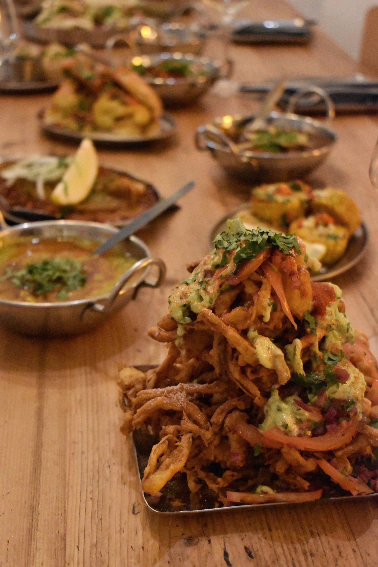 A table filled with Barua Indian sharing plates