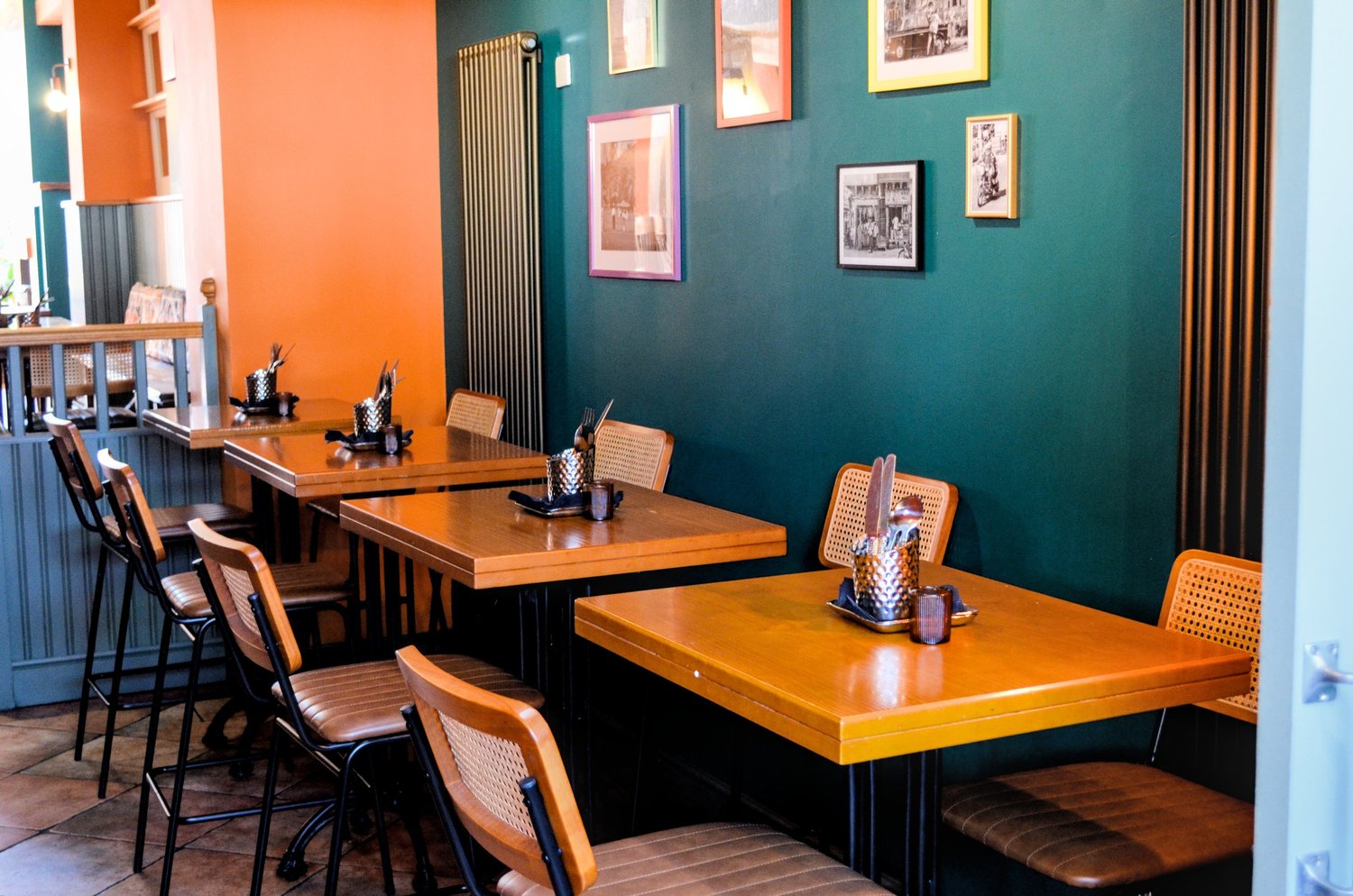 Barua's colourful teal and orange dining room
