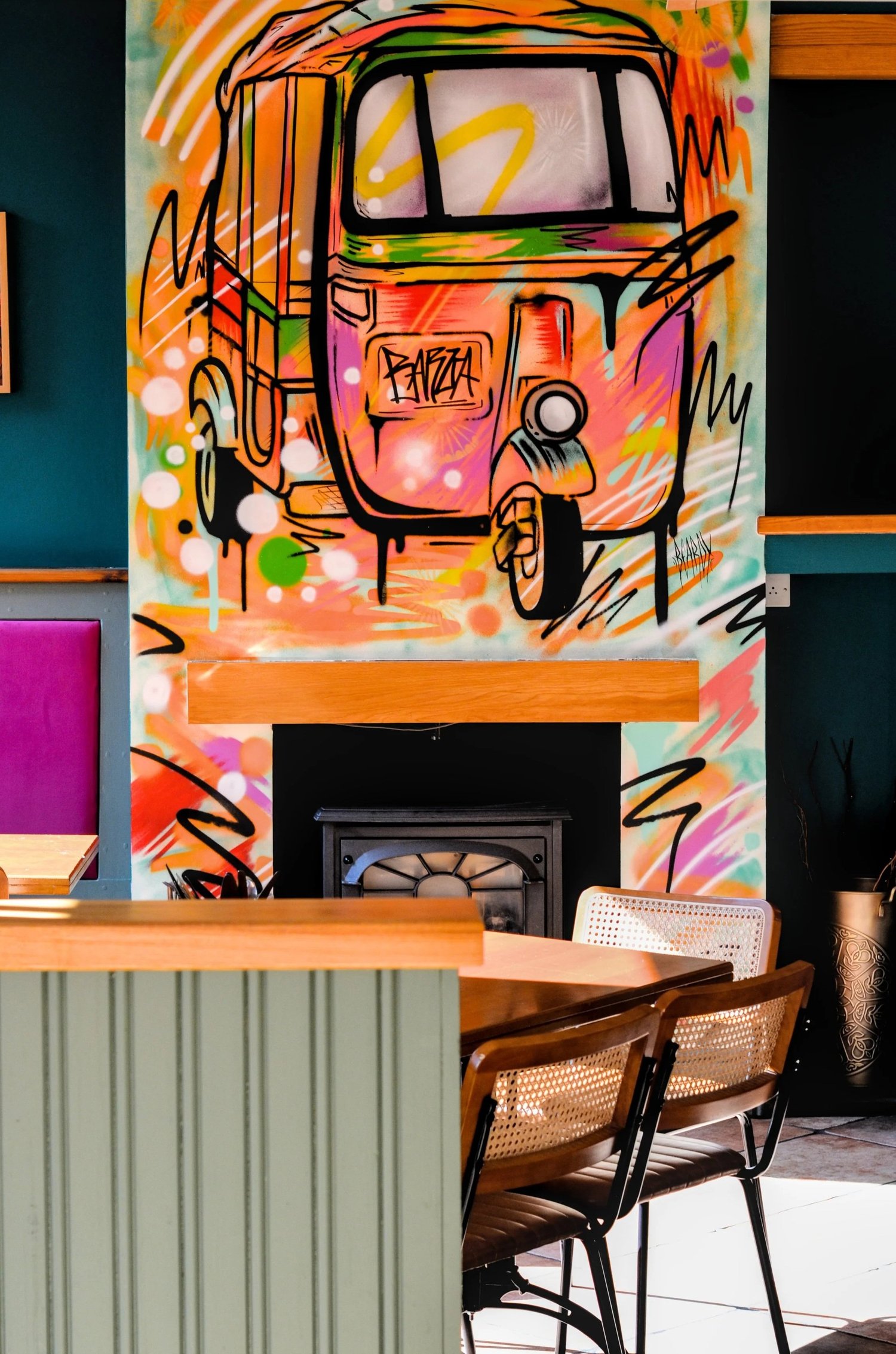 Colourful tuk-tuk mural inside Barua Street Food